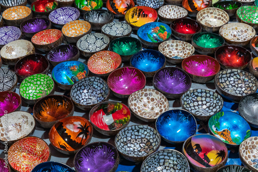 Souvenir colourfully lacquer bowls on the market at Luang Prabang in Laos. Homemade artworks by local people.