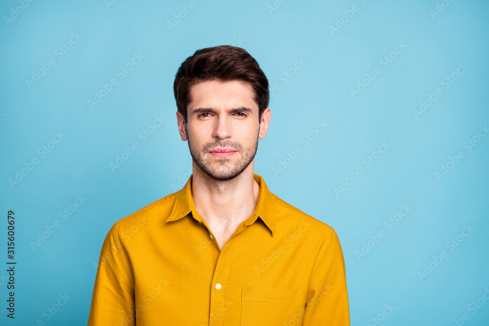 Photo of thoughtful strict manager standing confidently glancing at you candidly isolated over blue pastel color background Photo of thoughtful strict manager standing confidently glancing at you candidly isolated over blue pastel color background