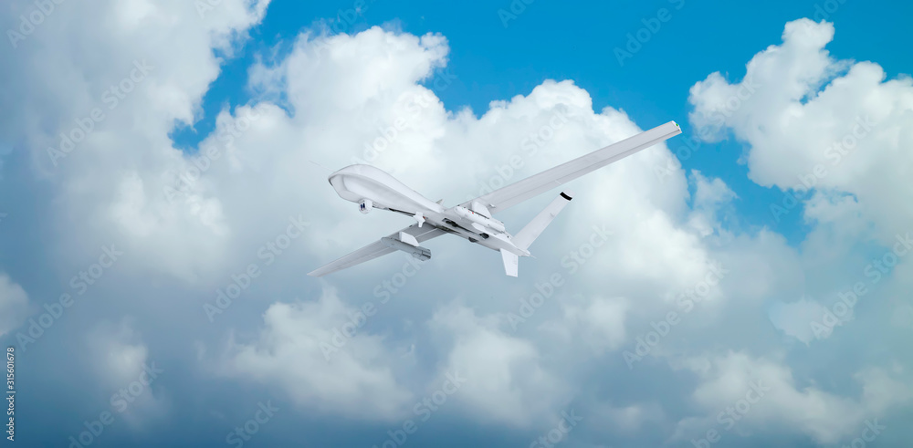military RC military drone flies flies against backdrop of beautiful clouds on blue sky background.