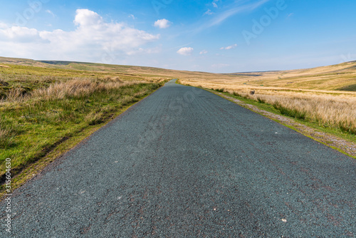 Rural road in the Yorkshire Dales near West Stonesdale  North Yorkshire  England  UK