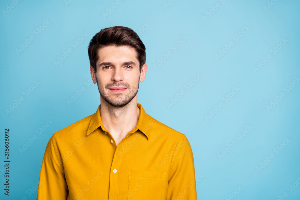 Fototapeta premium Photo of attractive brunet haired business man standing confidently near empty space isolated over pastel color background