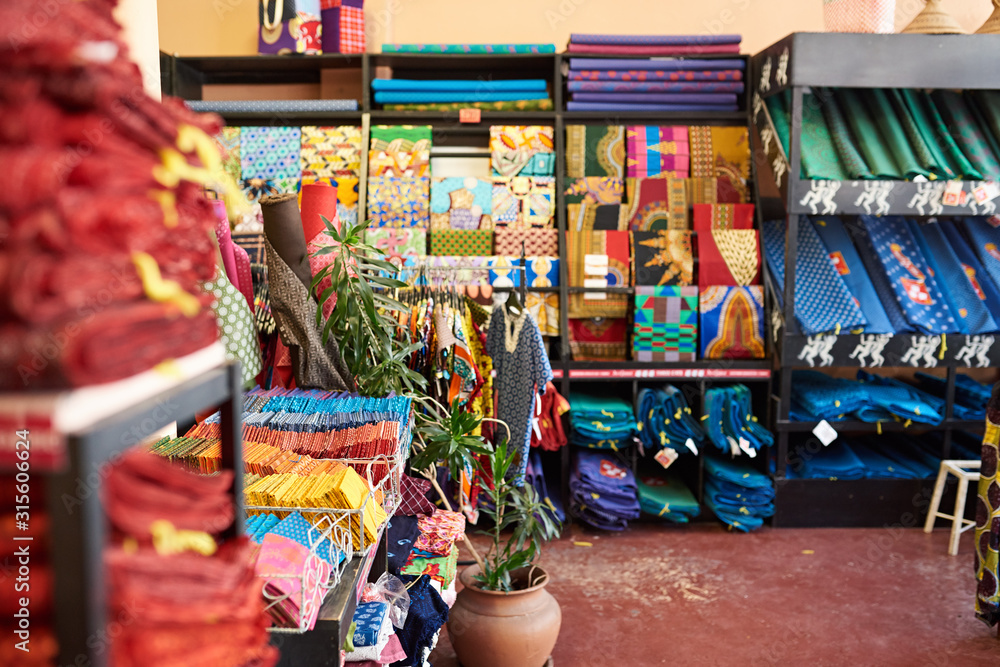 Assorted colorful textiles on display in a fabric shop