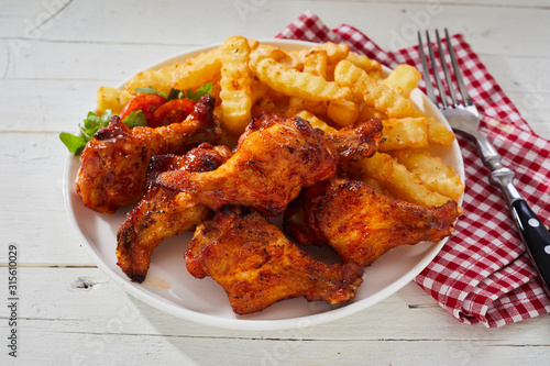 Spicy crumbed chicken wings with French Fries