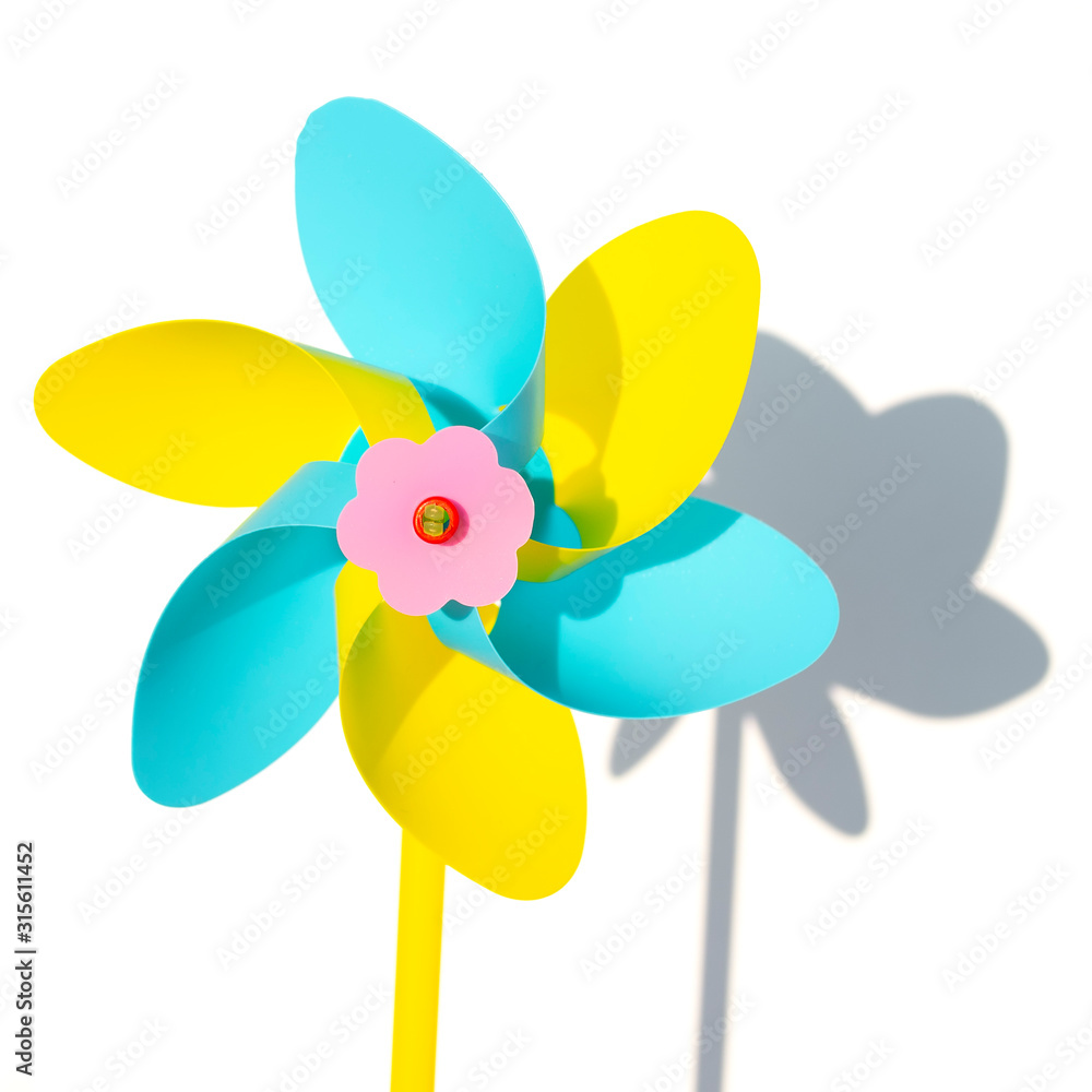Blue and yellow windmill pinwheel isolated on white backround Blue and yellow windmill pinwheel isolated on white backround