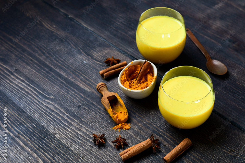 Fototapeta premium mango jelly mousse with spices in a glasses with cinnamon, fruit dessert recipe. vegan dessert without sugar