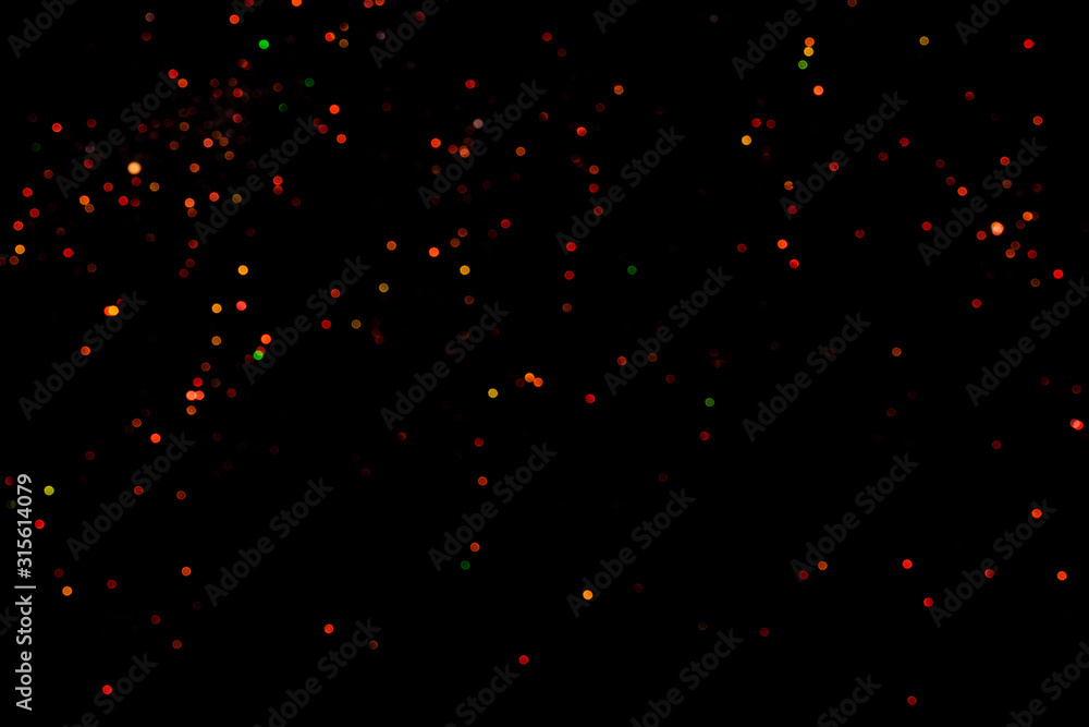 Red glitter bokeh lights on black background, unfocused. Holiday time. overlay layer Red glitter bokeh lights on black background, unfocused. Holiday time. overlay layer