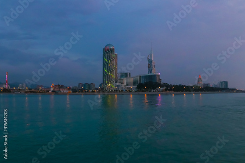 Batumi, Adjara, Georgia. View from the sea on illuminated resort town at evening