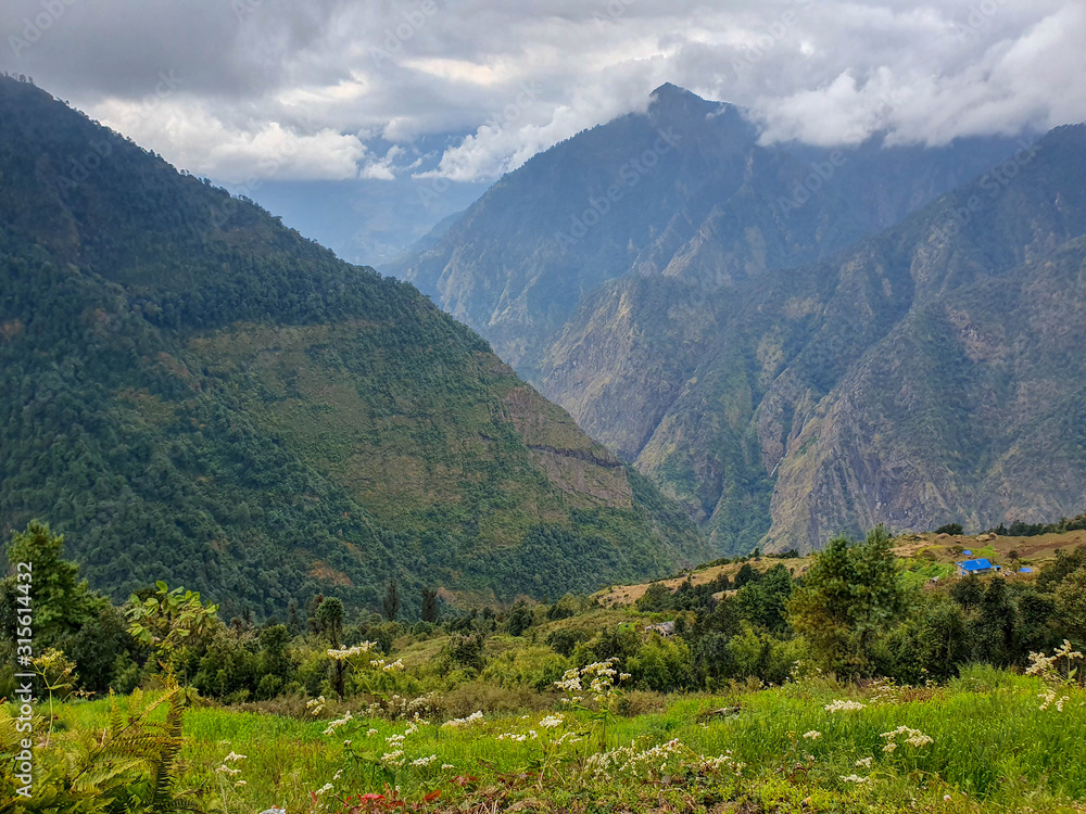 Everest base camp trek itinerary: way from Bupsa to Phakding. Beautiful views of the local villages, hills and mountains in Solokhumbu area, Nepal.
