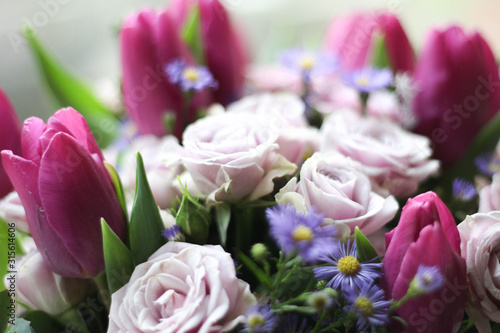 Bouquet of pink roses and tulips stock photo. Gift cards. Beautiful background flowers  roses and tulips. Greeting card  decoration for party.