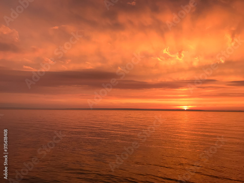 Fototapeta Naklejka Na Ścianę i Meble -  Red orange fire sunset at the sea