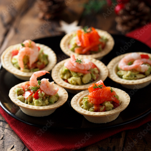 Salmon and shrimp appetizers with guacamole