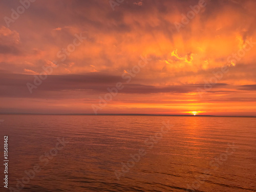 Red orange fire sunset at the sea © Oksana