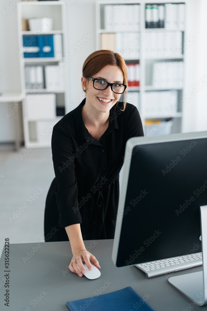 Hardworking businesswoman looking up with a smile Hardworking businesswoman looking up with a smile