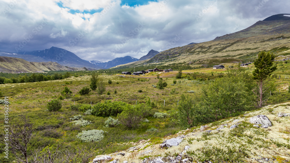 Obraz premium Cabins at the end of the road in Doralen valley, Rondane National Park, Innlandet, West Norway, Scandinavia, Europe