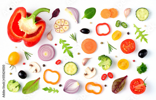 Food pattern with raw fresh ingredients of salad on white background. Creative layout made of vegetables,spices and herbs. Flat lay, top view. Food concept. 