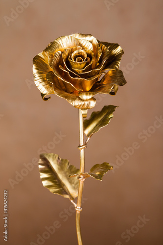  golden rose made of metal as symbol of eternal love