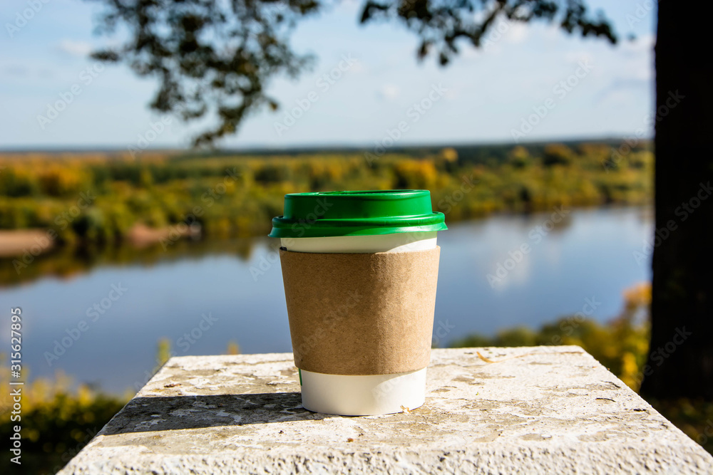 Coffee cup on the concrete standing. Beautiful autumn nature. Coffee cup on the concrete standing. Beautiful autumn nature.