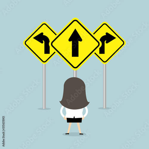 Businesswoman standing on three way arrows road sign.