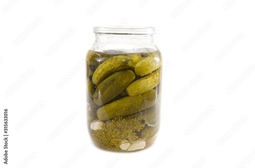 jar of pickled cucumbers on a white background. Homemade pickles. jar of pickled cucumbers on a white background. Homemade pickles.