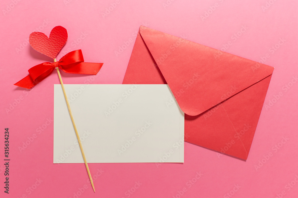 Valentine day greeting card template mockup with white paper card, pink envelope, red heart on pink background. Valentine day greeting card template mockup with white paper card, pink envelope, red heart on pink background.