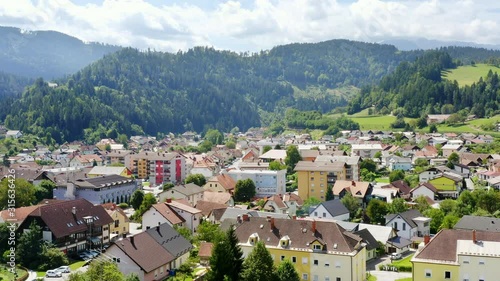 Aerial circle pan above town Prevalje in northern slovenia, province of Carinthia photo