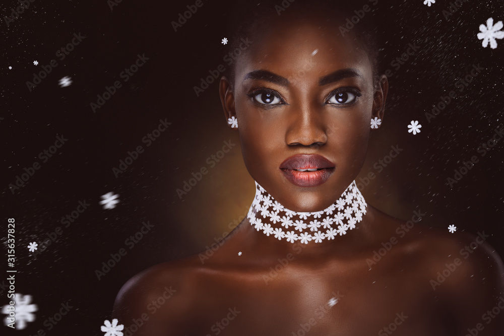 portrait of beautiful black woman with flowers