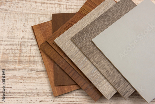 color sample boards for design on wooden desk.