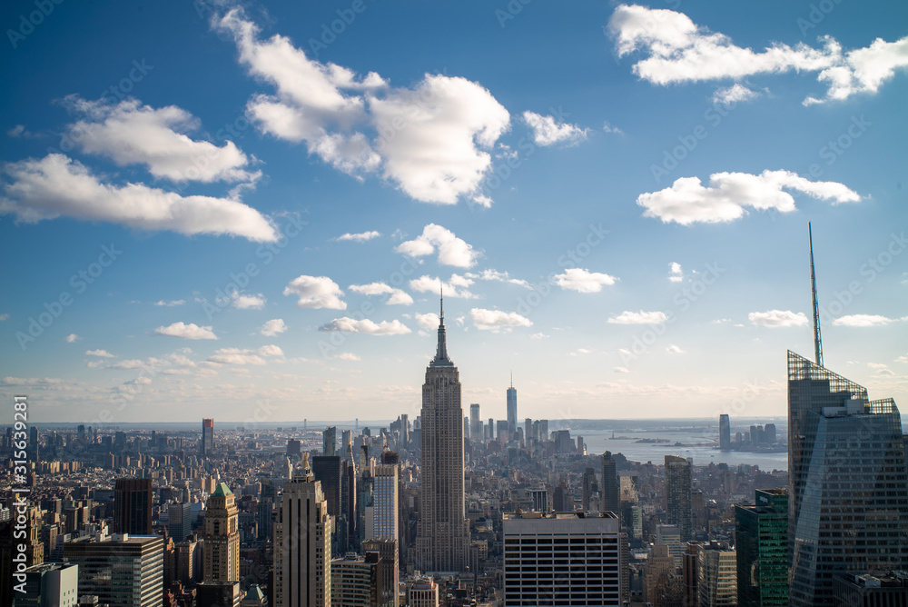 Manhattan Skyline with blue sky and some clouds