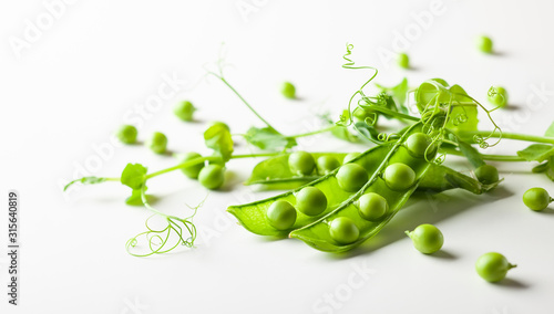 Fresh green peas pods and green peas