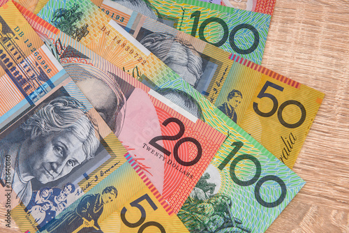 Colorful australian dollar banknotes close up on table photo