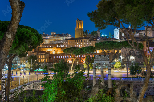 Night view of the ancient buildings of Rome: the Trajan Market and the Militia Tower photo