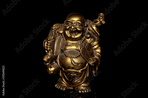 Laughing Buddha Hotei on a black background