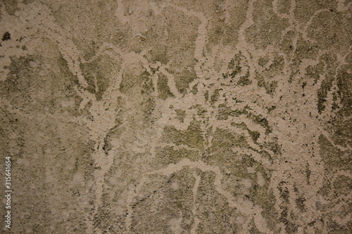 Water and mould stained concrete block.