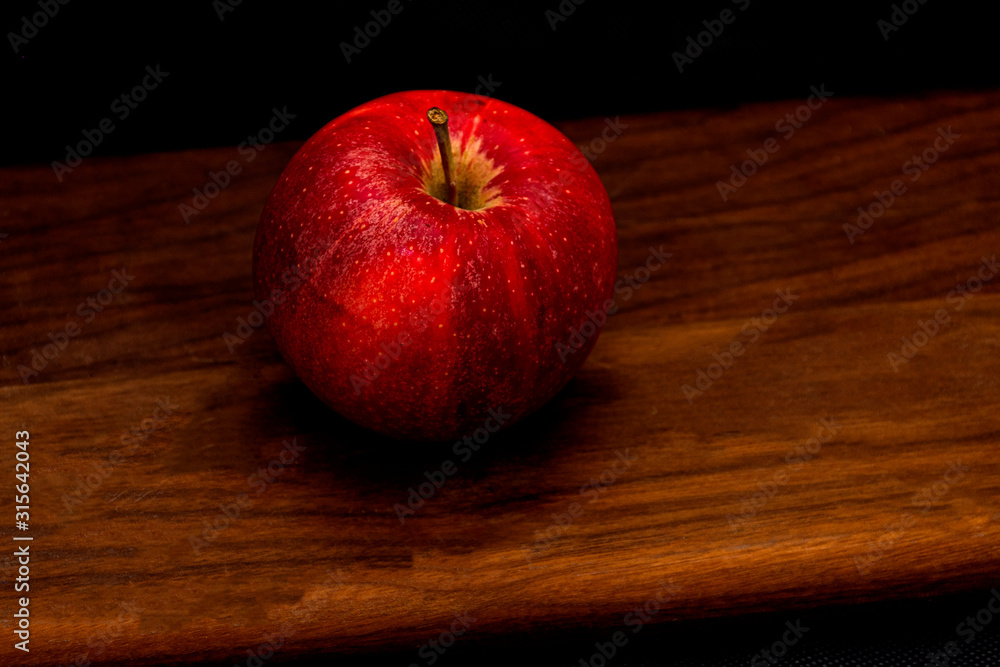 red apple juicy on wooden board vegan red apple juicy on wooden board vegan