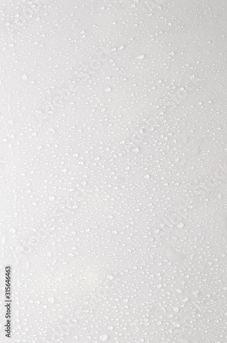 drops of water on a white surface