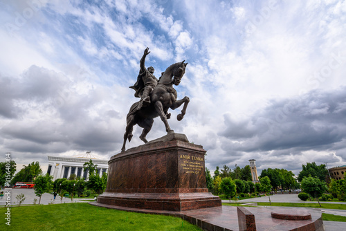 Statue of the legendary Tamerlane / Amir Temur on Horseback in Tashkent, Uzbekistan. Dramatic clouds, sunny day.