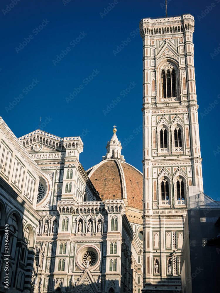 Detail of the cathedral of Florence with a blue sky