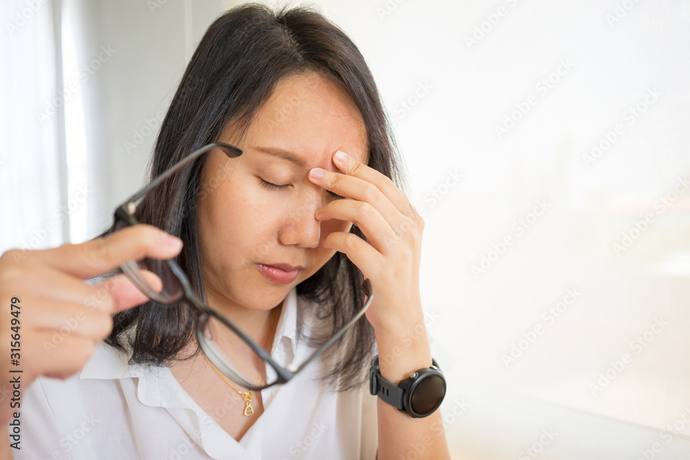 Businesswoman tired from working with digital tablet and overtime workload at the home office. Using smartphone tablet, Freelance Work, Business, Relax Sleeping and taking nap concept. Businesswoman tired from working with digital tablet and overtime workload at the home office. Using smartphone tablet, Freelance Work, Business, Relax Sleeping and taking nap concept.