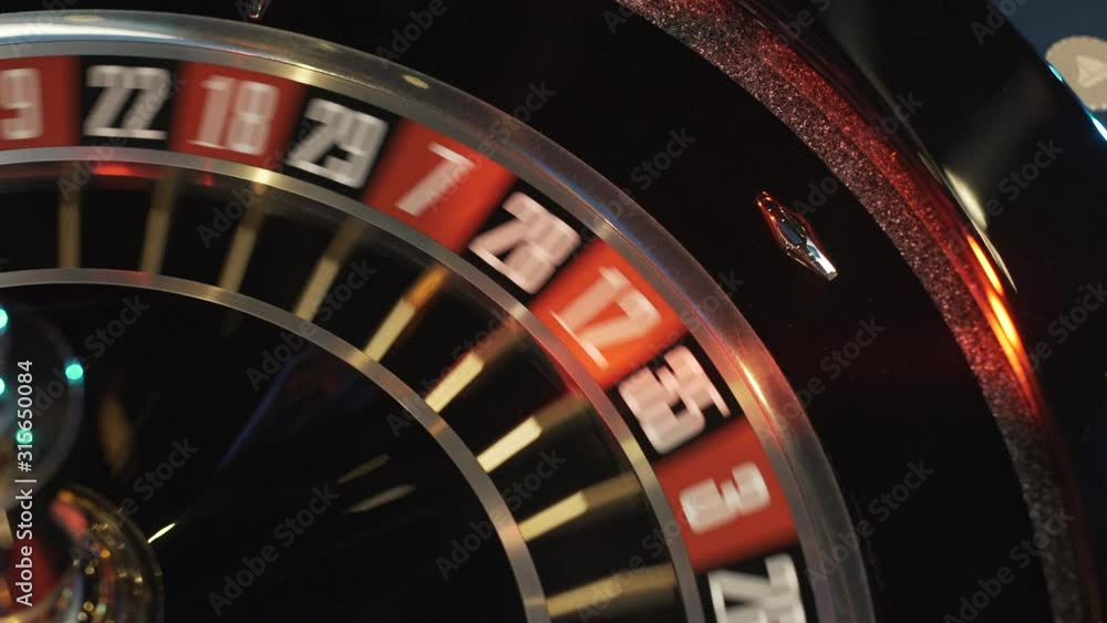 Ball spinning in roulette game in casino Ball spinning in roulette game in casino