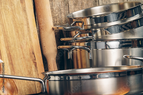 Set of stainless steel saucepans  in a kitchen