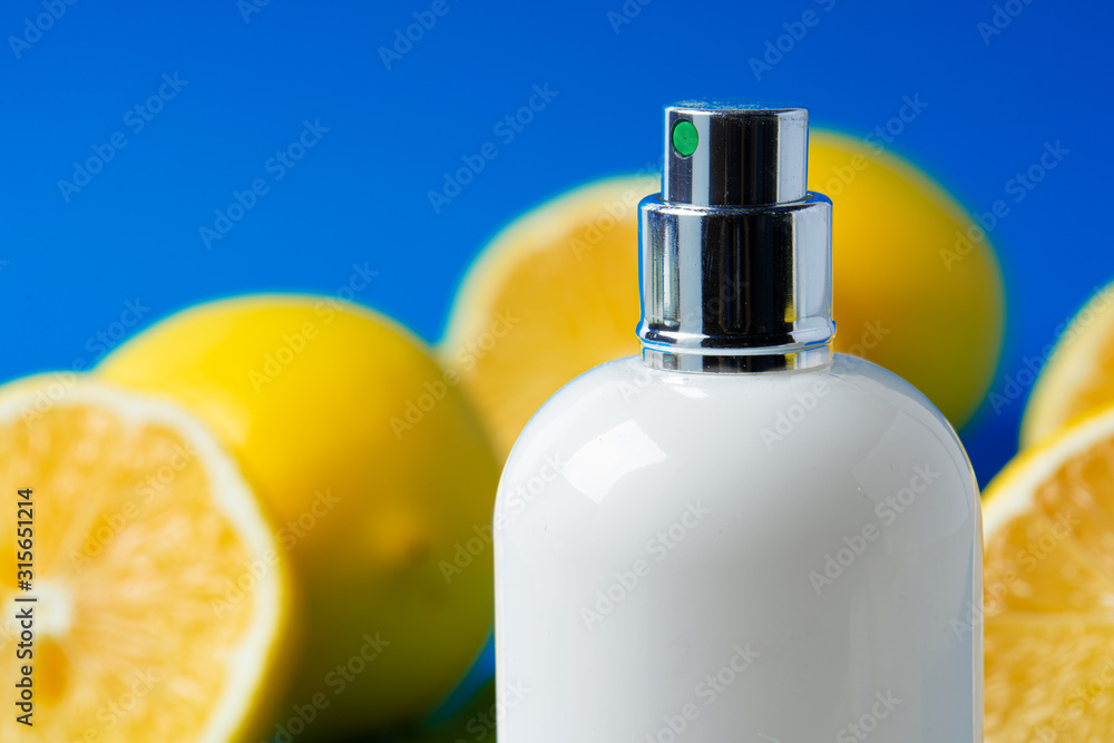 Bottle of skincare cosmetics with sliced lemons Bottle of skincare cosmetics with sliced lemons