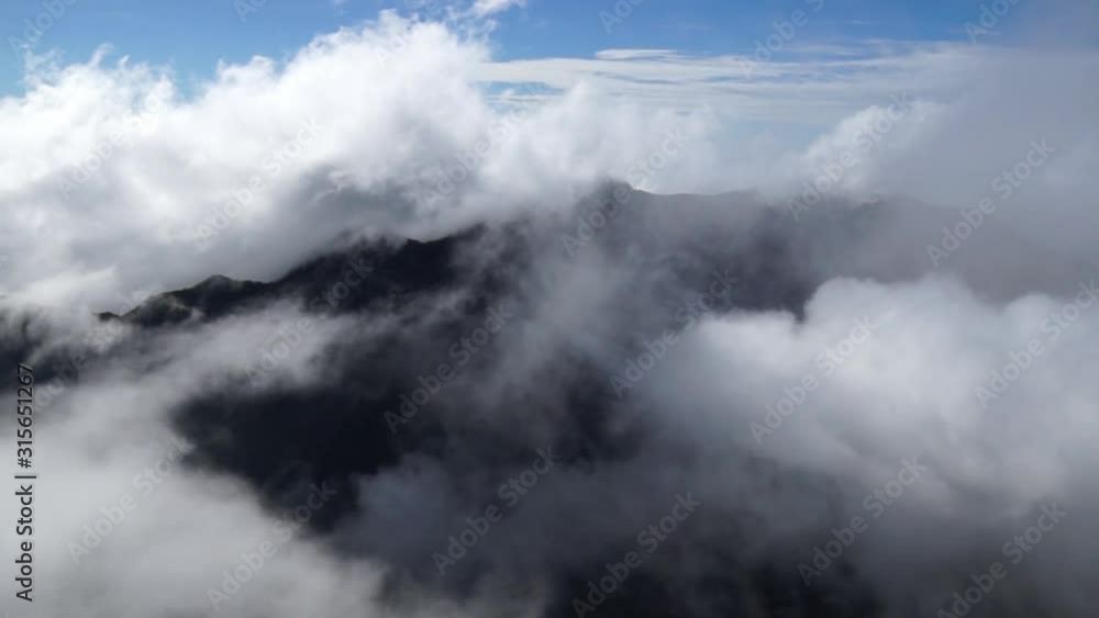 Moving fog clouds in the mountains of Horton Plains at Worlds End view point, Eliya Nuwara, Sri Lanka Moving fog clouds in the mountains of Horton Plains at Worlds End view point, Eliya Nuwara, Sri Lanka