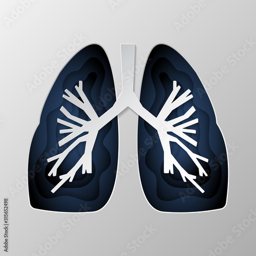 Blue silhouette of the lungs carved on paper.