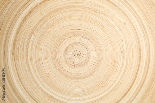 Fototapeta Naklejka Na Ścianę i Meble -  Wooden bowl circle texture background, close up