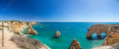 View on typical cliffy beach at Algarve coastline in Portugal in summer © Aquarius