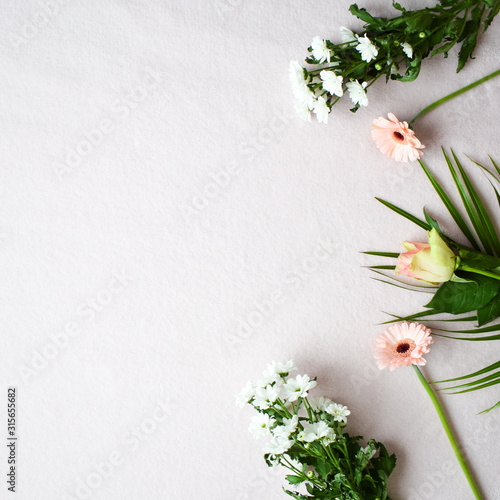 Lifestyle flat lay with different accessories: flower bouquet, pink flowers, rose, coral, pink, bright, white theme. Jungle flair. 