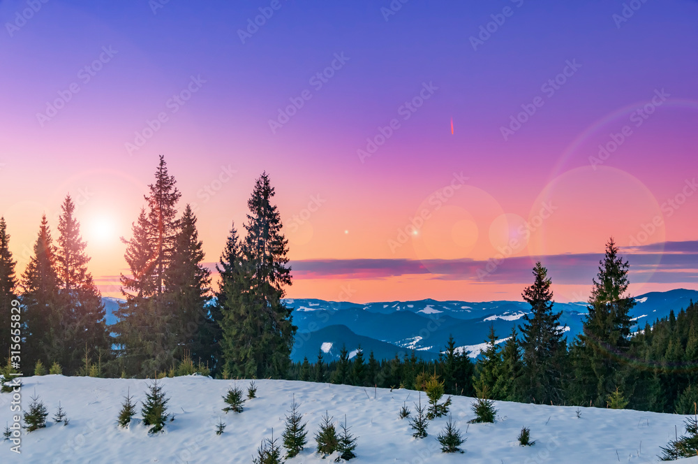 Fototapeta premium Magic pink sunset high in the winter mountains.