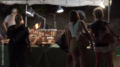 4k A Bunch Of People In Front Of An Incense Counter At A Flea Market