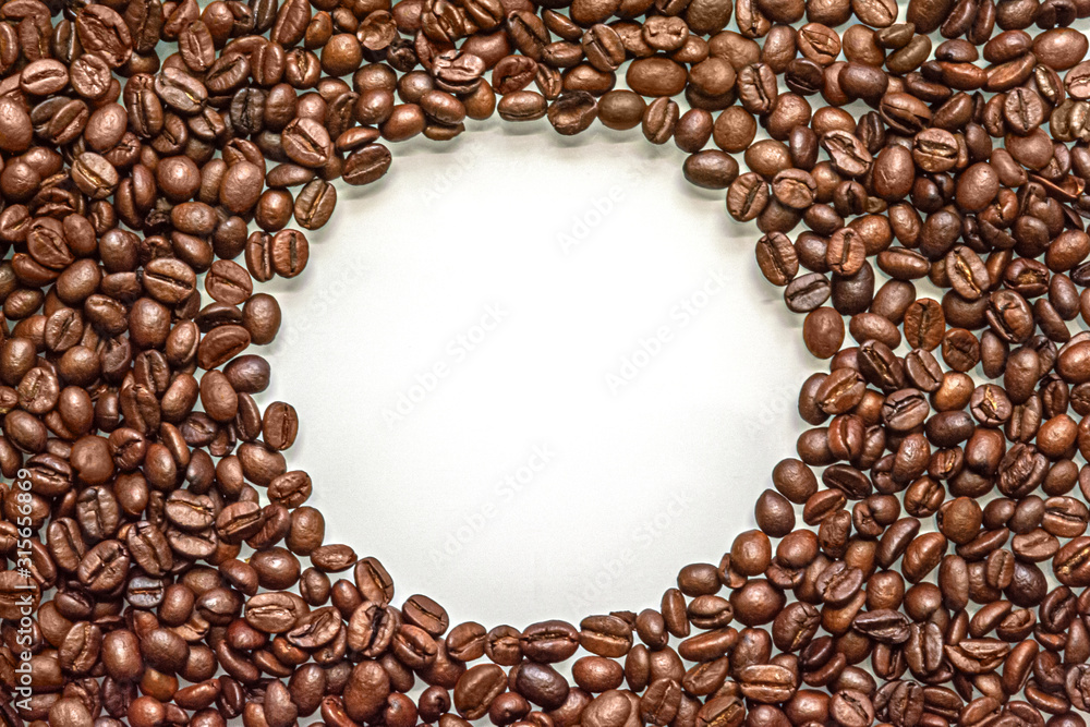 abstract background of coffee beans with copy space in the middle abstract background of coffee beans with copy space in the middle