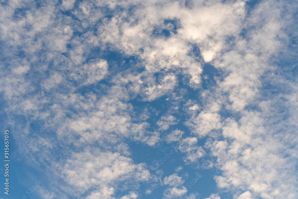 Beautiful blue sky with cirrus clouds. Bright positive background Beautiful blue sky with cirrus clouds. Bright positive background